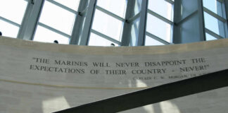 A quote honoring the Marines displayed on a wall in a memorial space