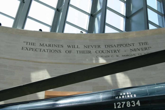 A quote honoring the Marines displayed on a wall in a memorial space