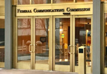 Entrance of the Federal Communications Commission building with glass doors