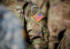 Shocking Attack: US Base Breached in Saudi Arabia Close-up of a military uniform featuring an American flag patch