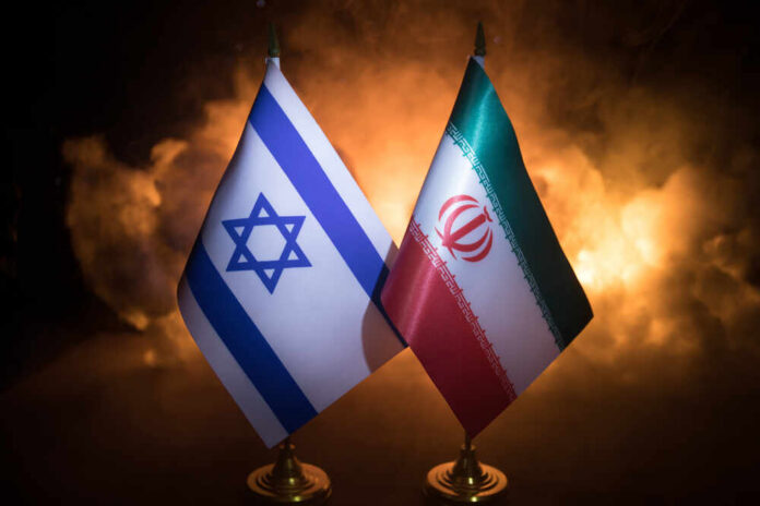 Flags of Israel and Iran displayed against a smoky background