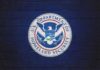 Republicans Slam Democrats: DHS Held Hostage Logo of the U.S. Department of Homeland Security on a blue wall