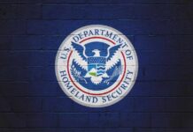 Logo of the U.S. Department of Homeland Security on a blue wall