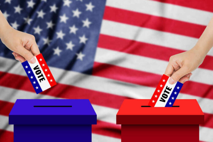 A hand placing a vote into a ballot box with an American flag background