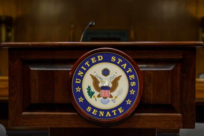 Podium with the United States Senate seal in a formal setting
