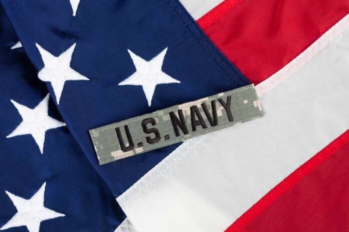 Close-up of an American flag with a U.S. Navy insignia