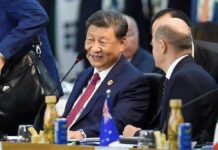 Beijing’s Diplomatic Gamble: Middle East in Play Two political leaders engaged in conversation at a conference table