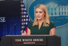 A woman speaking at a podium during a White House press briefing