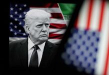 Donald Trump in front of an American flag, displaying a serious expression