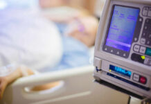 IV pump displaying medication flow rate in a hospital room