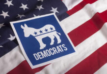Democrats Weaponize Intelligence: Gabbard Under Fire Democratic Party logo featuring a donkey on an American flag background