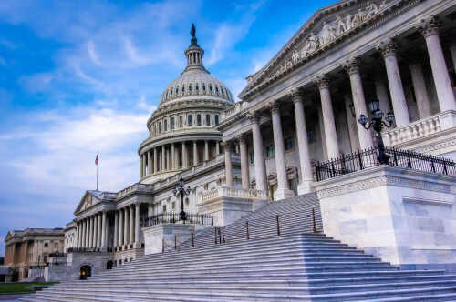 shutterstock_1161479314 (1).jpg The U.S. Capitol building with its iconic dome and steps under a blue sky