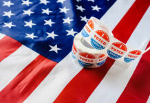 Unelected Regulators Seize Power From Voters Voting stickers on an American flag background