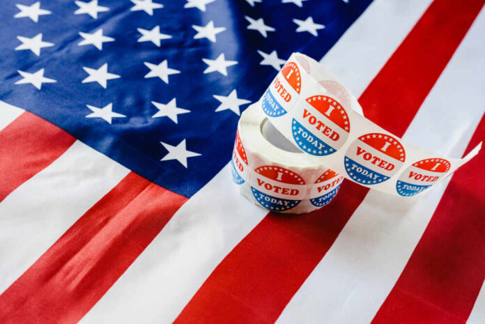 Voting stickers on an American flag background