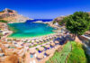 A picturesque beach with turquoise water and sun umbrellas
