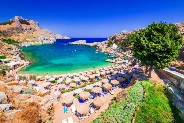 A picturesque beach with turquoise water and sun umbrellas