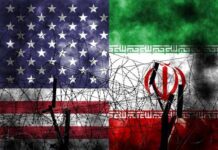 American and Iranian flags intertwined with barbed wire