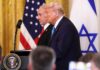 U.S. Ties Drag Deeper into Israeli Defense Donald Trump and another official at a press conference with flags in the background