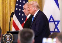 U.S. Ties Drag Deeper into Israeli Defense Donald Trump and another official at a press conference with flags in the background