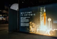 Artemis II Triumph: The Unexpected NASA Win Exhibition display welcoming visitors to the Artemis program with a rocket image