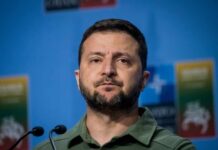 Ukraine’s Drone Offer: Hormuz Standoff Escalates A political leader speaking at a press conference with a serious expression