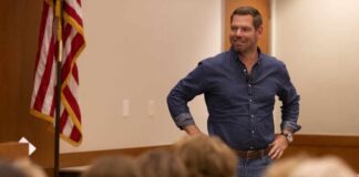 A speaker engaging with an audience in a professional setting