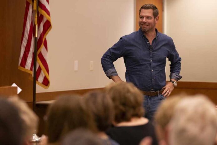 A speaker engaging with an audience in a professional setting