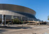 Exterior view of the Caesars Superdome in New Orleans on a clear day