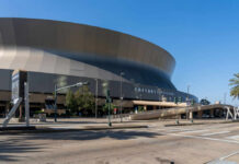 Exterior view of the Caesars Superdome in New Orleans on a clear day