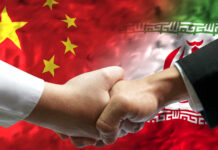 Xi’s Secret Strategy: Is Washington Losing Control? Handshake between two individuals with Chinese and Iranian flags in the background