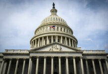 The U.S. Capitol building with an American flag flying in front