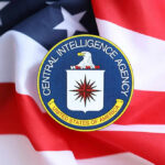Governor’s Immunity CHALLENGED Over CIA Allegations CIA emblem displayed on an American flag background