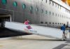 Passengers boarding a Disney cruise ship via a ramp