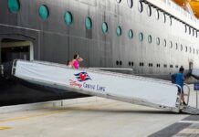 Passengers boarding a Disney cruise ship via a ramp