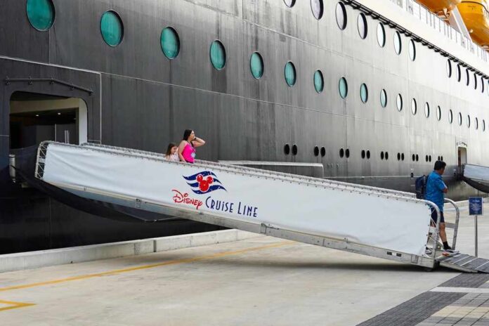 Passengers boarding a Disney cruise ship via a ramp