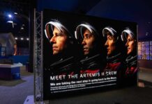 Display featuring the Artemis II crew with astronauts in spacesuits