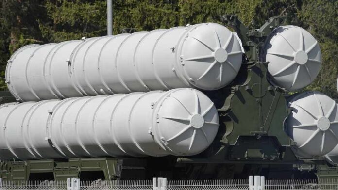 Close-up of a military missile system with cylindrical launchers