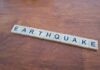 Monster Quake Slams Mindanao Scrabble tiles spelling earthquake on a wooden table