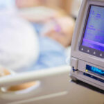 Chemo Vs. Baby: What Doctors Don’t Say IV pump displaying medication flow rate in a hospital room