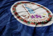 Bathroom Brawl Erupts After Spanberger Pick Virginia state flag featuring a central emblem on a blue background