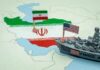 Map of Iran with Iranian and U.S. flags and a model warship