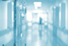 IV drip in a hospital corridor with a blurred background
