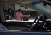 Wild Chase Slams DoorDash Driver Police officers interacting with a civilian during a traffic stop