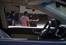Police officers interacting with a civilian during a traffic stop
