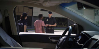 Police officers interacting with a civilian during a traffic stop