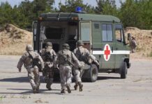 Iran Strike Fallout: Third U.S. KIA Named Soldiers running towards a medical vehicle during a military operation