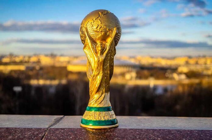 shutterstock_1070022398-1 Golden soccer world cup trophy outdoors