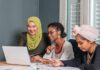 CCP Money Trail Hits Georgetown Three women collaborating at a laptop in an office