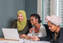 CCP Money Trail Hits Georgetown Three women collaborating at a laptop in an office