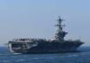 Aircraft carrier cruising at sea